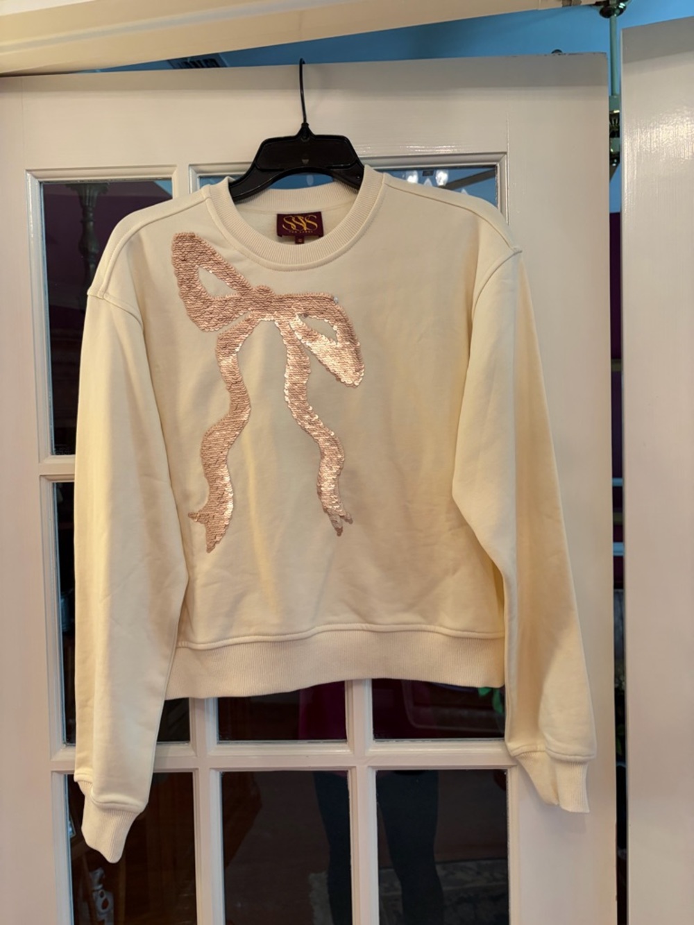 Cream Pullover Sweatshirt with Pink Sequin Bow